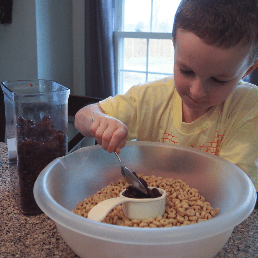 Connor scooping cranberries